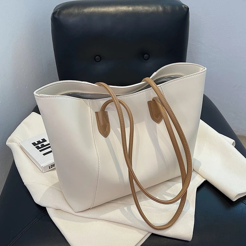 Lori – Schoudertas met handvatten en intern ritsvak