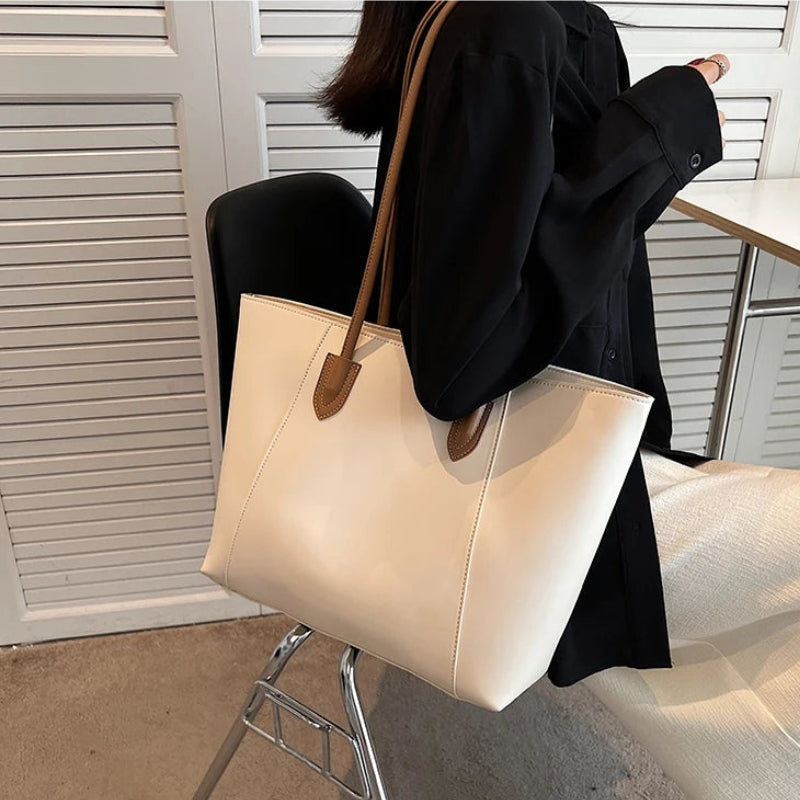 Lori – Schoudertas met handvatten en intern ritsvak