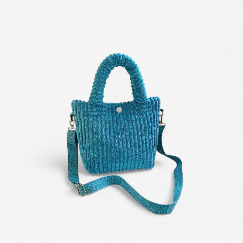 Megan – Handtas met verstelbare riem en knoopsluiting