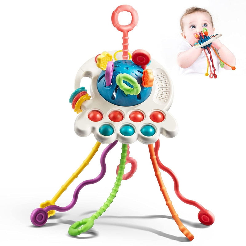 Ufo Bloom – Klassiek babyspeelgoed in de vorm van een UFO met trekkoorden en voelbare zijknoppen
