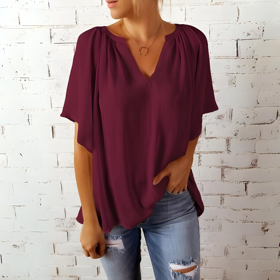 Rena - Elegante V-hals blouse met vloeiende mouwen