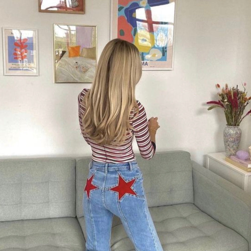 Bianca - Hoge taille flared jeans met steraccenten en detail aan de voorkant