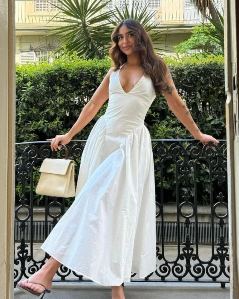 Celestia - Elegante mouwloze vloeiende jurk met diepe V-hals en rugloze A-lijn pasvorm