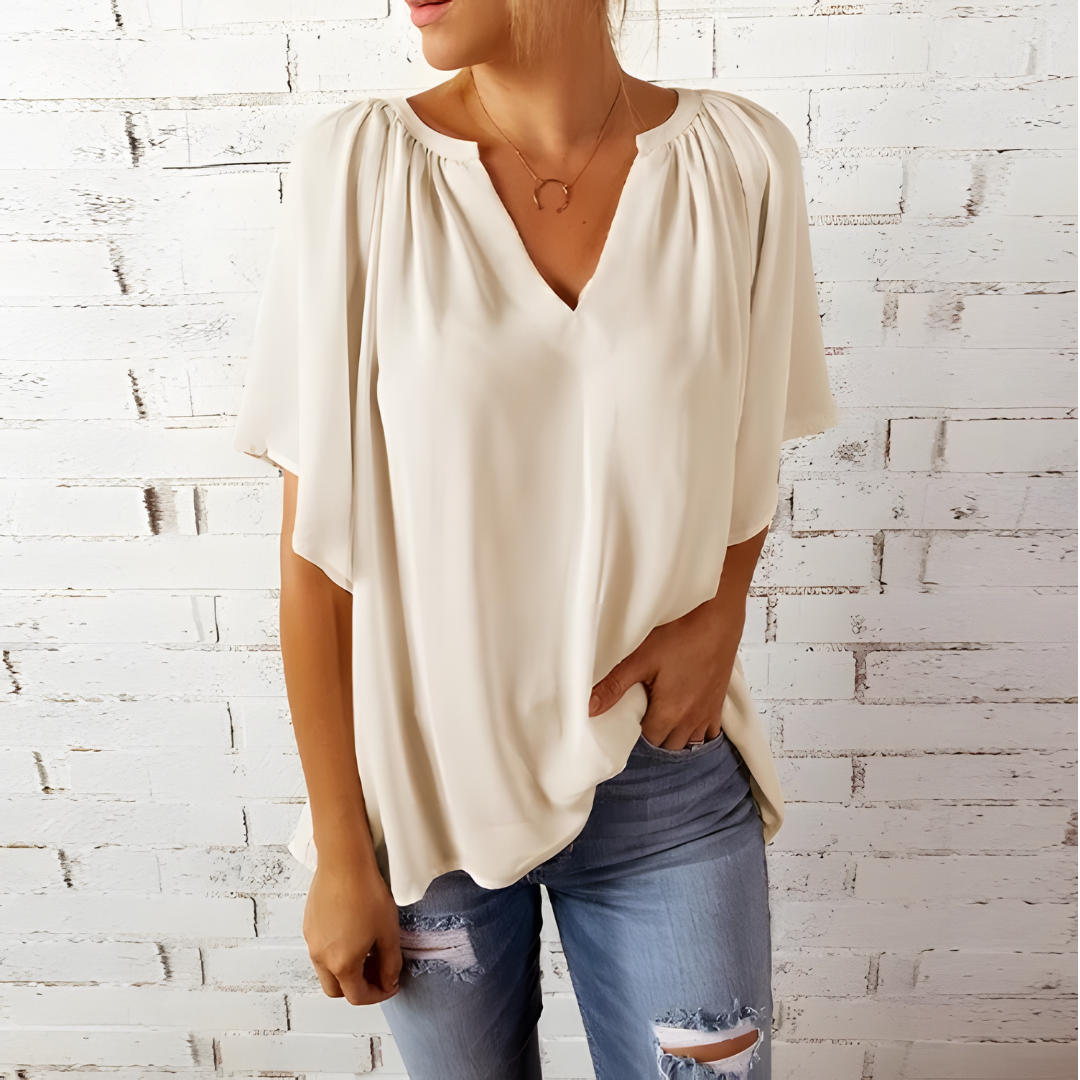 Rena - Elegante V-hals blouse met vloeiende mouwen