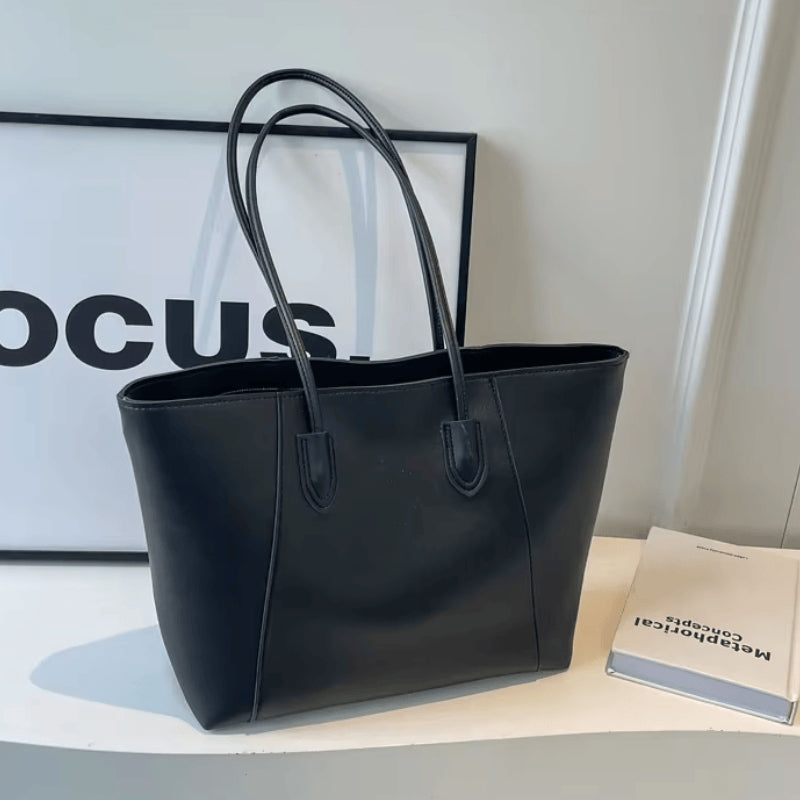 Lori – Schoudertas met handvatten en intern ritsvak