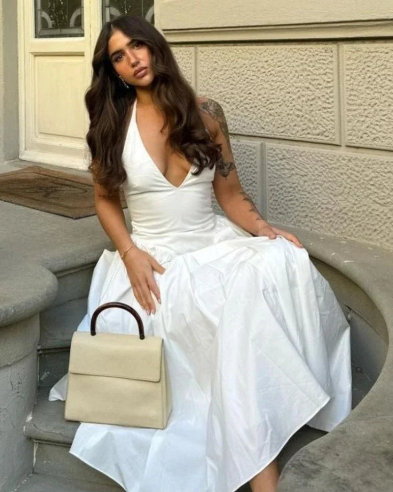 Celestia - Elegante mouwloze vloeiende jurk met diepe V-hals en rugloze A-lijn pasvorm