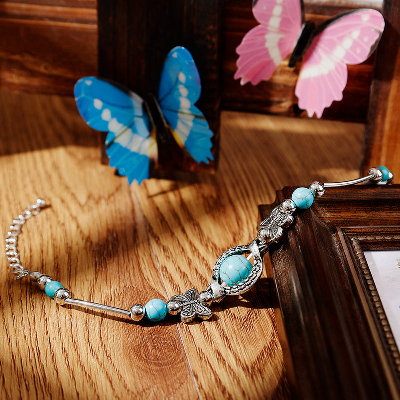 Aria – Kralenarmband met vlinderbedels en verstelbare ketting